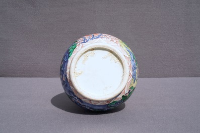 A Chinese wucai bottle vase with birds in a garden, Transitional period